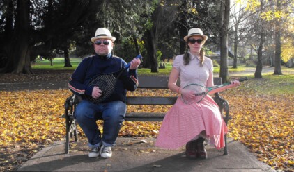 Fred and Alice Guitars sitting on Park Bench